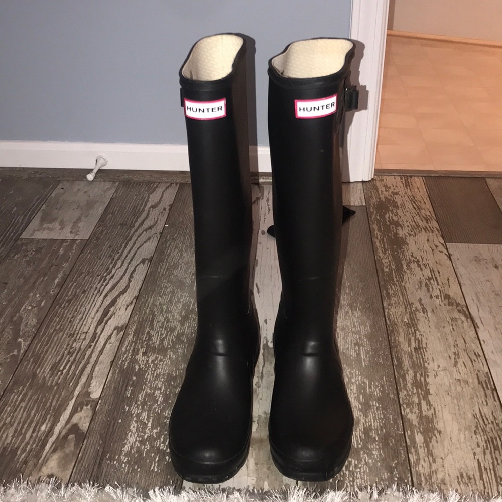 Tall black hunter boots